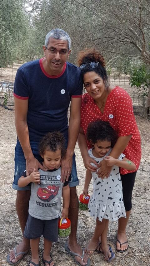 A family together in an orchard